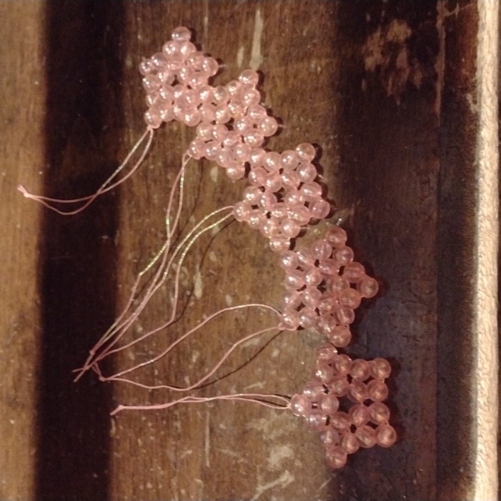 Bead star ornaments, all handmade, clear pink, varying color string.